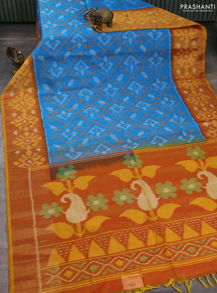 Ikat silk cotton saree light blue and dark mustard with allover ikat weaves and long zari woven ikat border