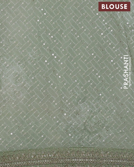 Georgette saree pastel green with allover sequin work & floral digital prints and sequin work border