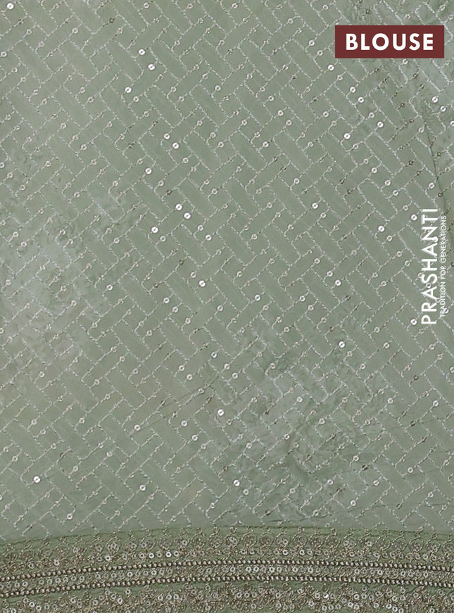 Georgette saree pastel green with allover sequin work & floral digital prints and sequin work border