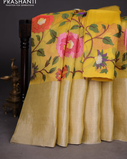 Organza silk saree yellow with allover floral embroidery work and long zari woven border
