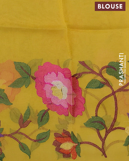 Organza silk saree yellow with allover floral embroidery work and long zari woven border