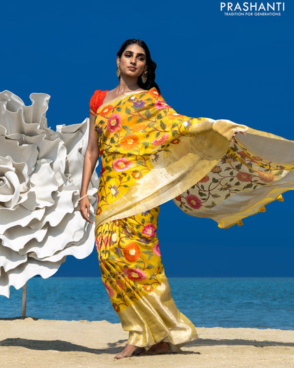Organza silk saree yellow with allover floral embroidery work and long zari woven border