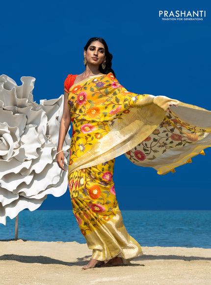 Organza silk saree yellow with allover floral embroidery work and long zari woven border