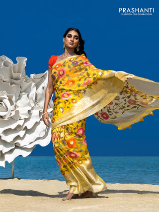 Organza silk saree yellow with allover floral embroidery work and long zari woven border