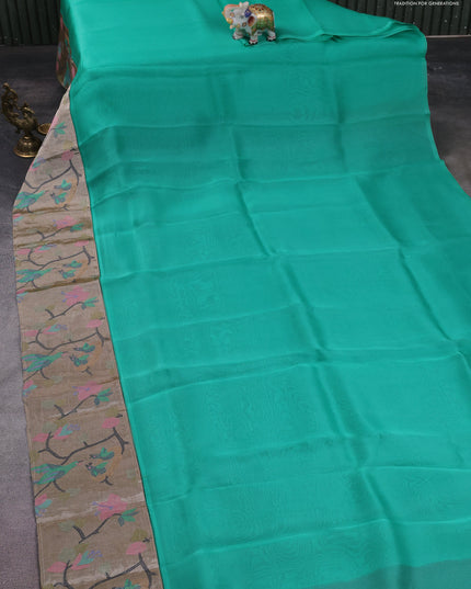 Organza silk saree teal green with plain body and embroidery border