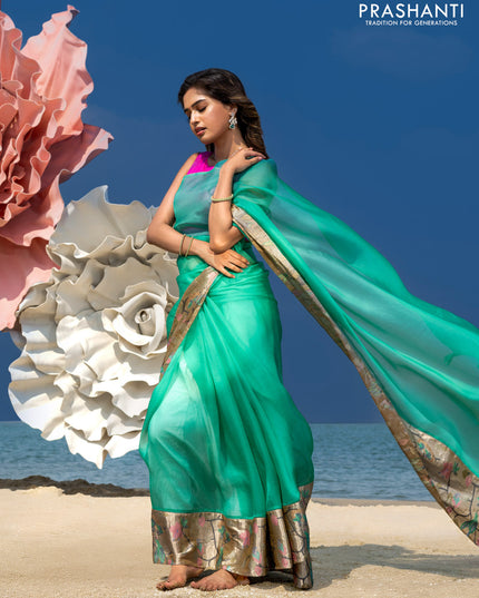Organza silk saree teal green with plain body and embroidery border