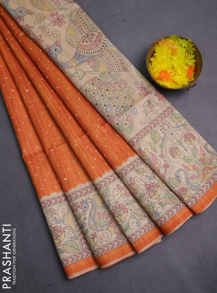 Semi tussar saree orange and beige with allover butta prints and madhubani printed pallu & border