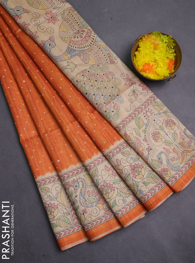 Semi tussar saree orange and beige with allover butta prints and madhubani printed pallu & border