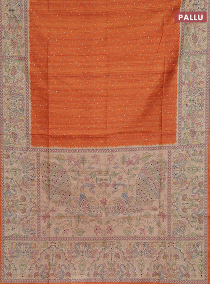 Semi tussar saree orange and beige with allover butta prints and madhubani printed pallu & border