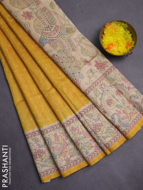 Semi tussar saree mustard yellow and cream with allover butta prints and madhubani printed pallu & border