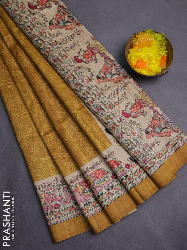 Semi tussar saree dark mustard and beige with allover prints and madhubani printed pallu & border