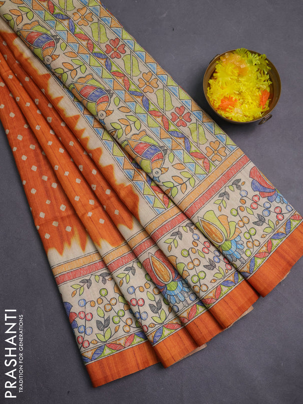 Semi tussar saree orange and beige with allover bandhani prints and madhubani printed pallu & border