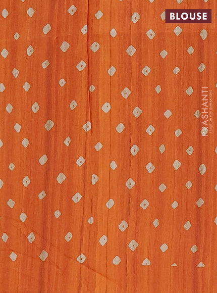 Semi tussar saree orange and beige with allover bandhani prints and madhubani printed pallu & border