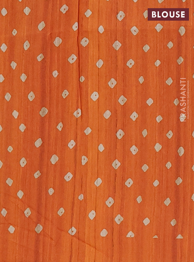 Semi tussar saree orange and beige with allover bandhani prints and madhubani printed pallu & border