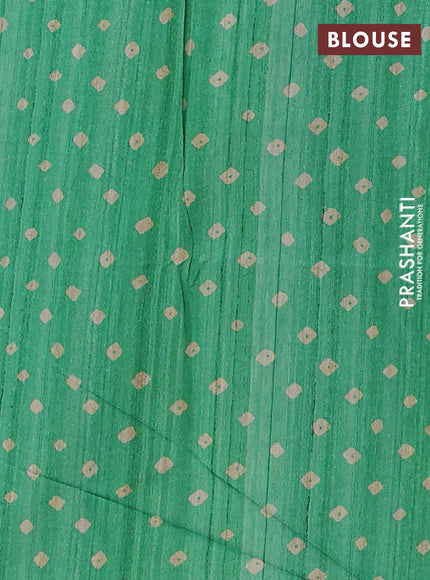 Semi tussar saree green and beige with allover bandhani prints and madhubani printed pallu & border