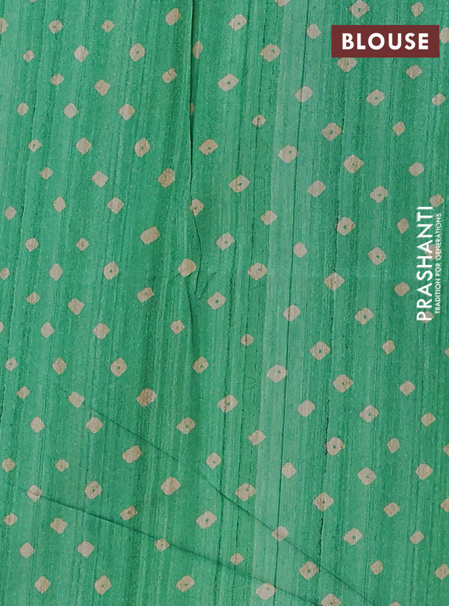 Semi tussar saree green and beige with allover bandhani prints and madhubani printed pallu & border