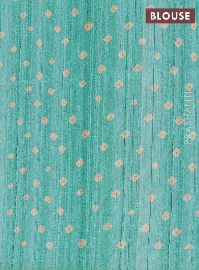Semi tussar saree green and beige with allover bandhani prints and madhubani printed pallu & border