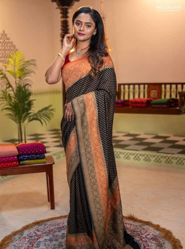 Banarasi georgette saree black and orange with allover thread & zari woven buttas and long woven border