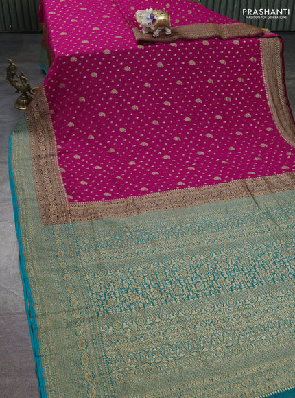 Banarasi georgette saree rani pink and teal green with allover thread & zari woven buttas and long woven border