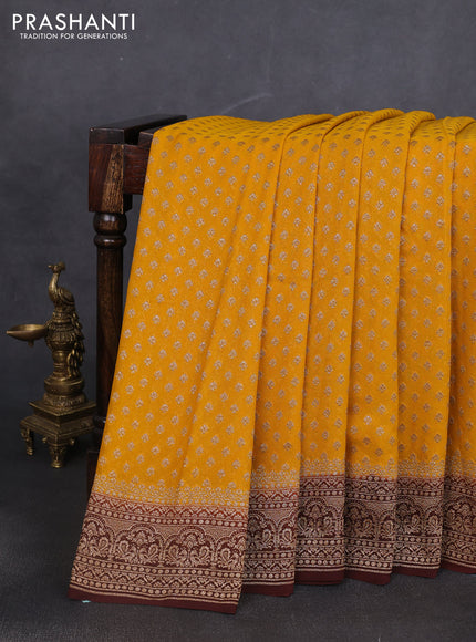 Banarasi georgette saree yellow and brown with allover thread & zari woven buttas and woven border