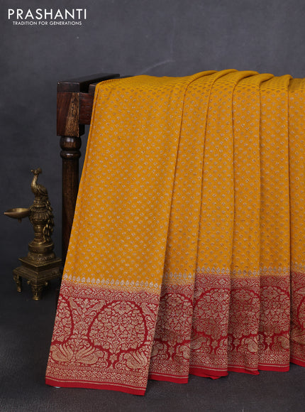 Banarasi georgette saree mango yellow and kumkum red with allover thread & zari woven buttas and woven border