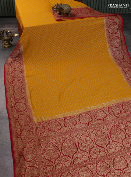 Banarasi georgette saree mango yellow and kumkum red with allover thread & zari woven buttas and woven border