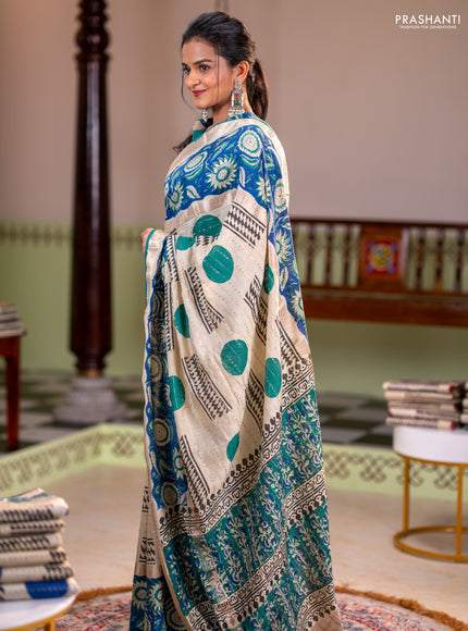 Semi chanderi saree cream and blue with allover zari weaves & geometric block prints and long printed border