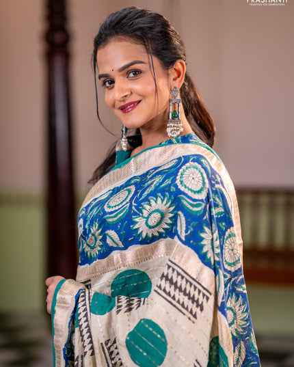 Semi chanderi saree cream and blue with allover zari weaves & geometric block prints and long printed border