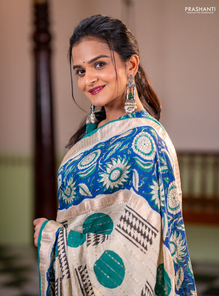 Semi chanderi saree cream and blue with allover zari weaves & geometric block prints and long printed border