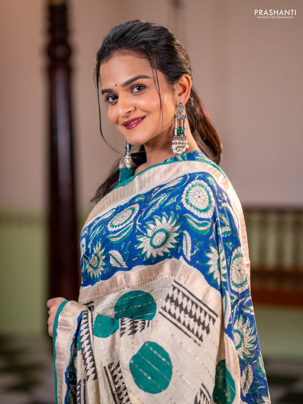 Semi chanderi saree cream and blue with allover zari weaves & geometric block prints and long printed border