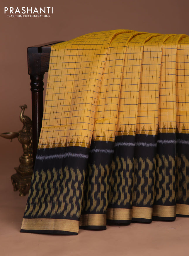 Ikat soft silk saree yellow and black with allover checks & ikat butta weaves and long temple ikat woven zari border