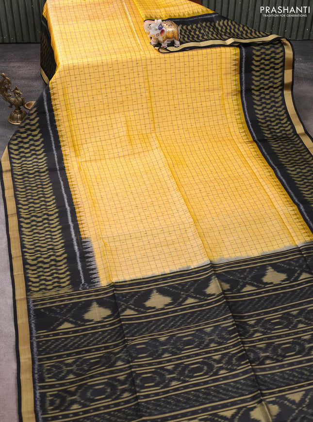 Ikat soft silk saree yellow and black with allover checks & ikat butta weaves and long temple ikat woven zari border