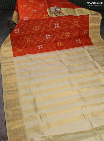 Kora kanchipuram silk saree orange and cream with allover zari checks & buttas and zari woven korvai border