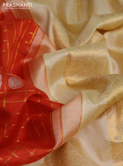 Kora kanchipuram silk saree orange and cream with allover zari checks & buttas and zari woven korvai border