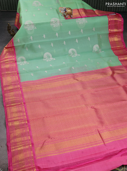 Kora kanchipuram silk saree pastel green and light pink with silver zari woven buttas and rich zari woven korvai border