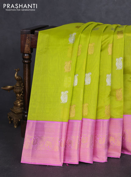 Kora kanchipuram silk saree fluorescent green and pastel pink with annam zari woven buttas and zari woven border