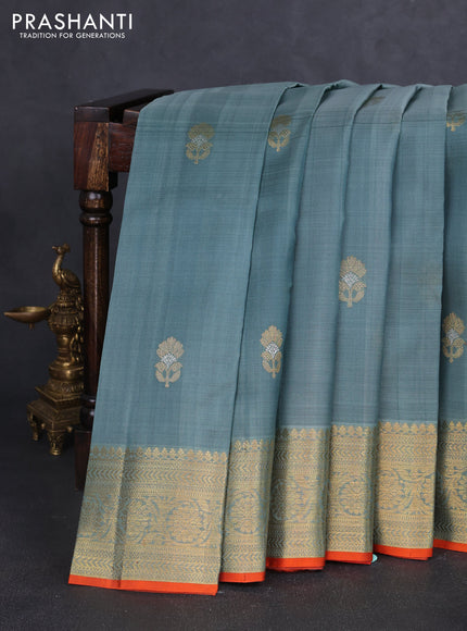 Kora kanchipuram silk saree greyish blue and orange with floral zari woven buttas and zari woven border