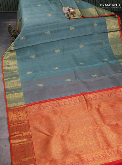 Kora kanchipuram silk saree greyish blue and orange with floral zari woven buttas and zari woven border