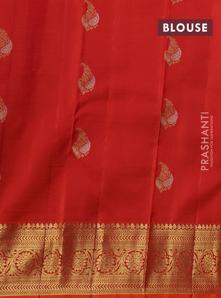 Kora kanchipuram silk saree greyish blue and orange with floral zari woven buttas and zari woven border
