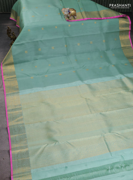 Kora kanchipuram silk saree pastel green and candy pink with zari woven buttas and zari woven border