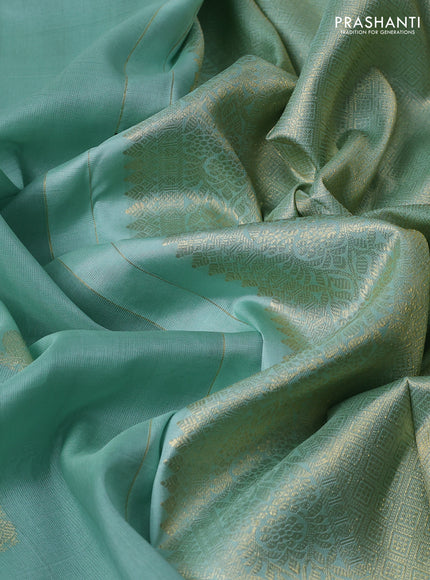 Kora kanchipuram silk saree pastel green and candy pink with zari woven buttas and zari woven border