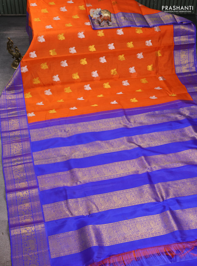 Kora kanchipuram silk saree orange and blue with allover silver & gold zari woven buttas and zari woven korvai border