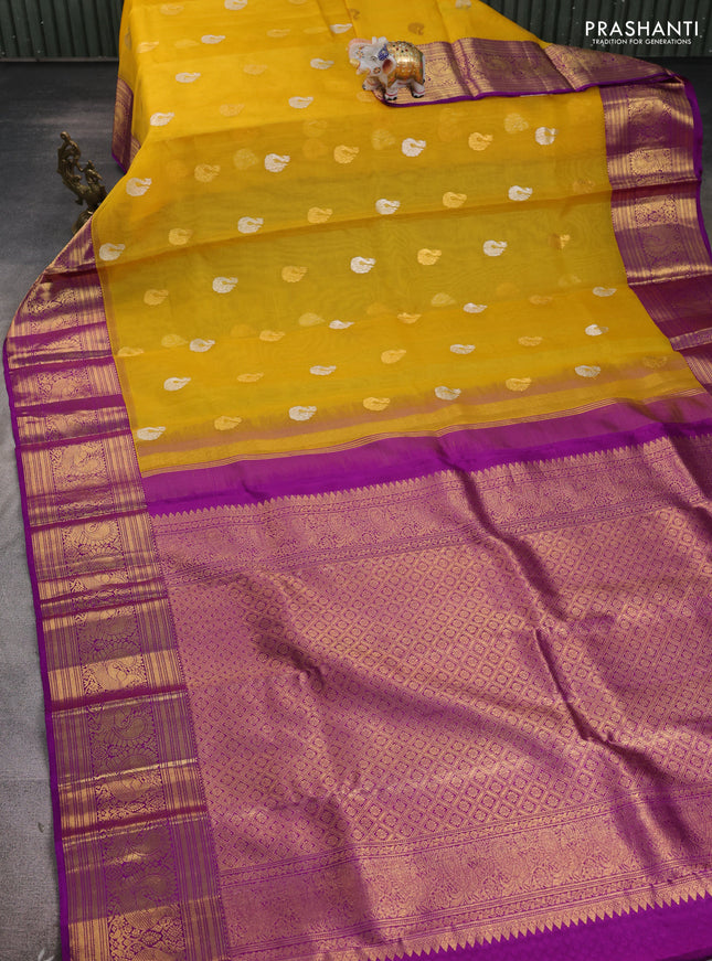 Kora kanchipuram silk saree yellow and purple with annam zari woven buttas and zari woven korvai border