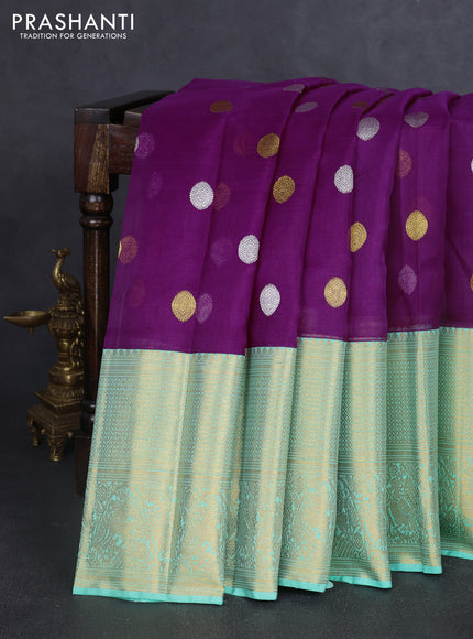 Kora kanchipuram silk saree purple and teal green with allover silver & gold zari woven buttas and long zari woven korvai border