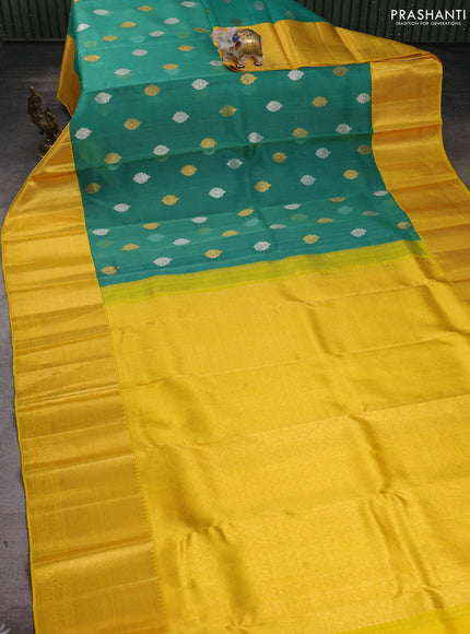 Kora kanchipuram silk saree green and yellow with allover silver & gold zari woven buttas and long zari woven korvai border