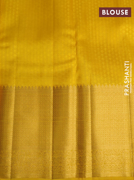 Kora kanchipuram silk saree green and yellow with allover silver & gold zari woven buttas and long zari woven korvai border