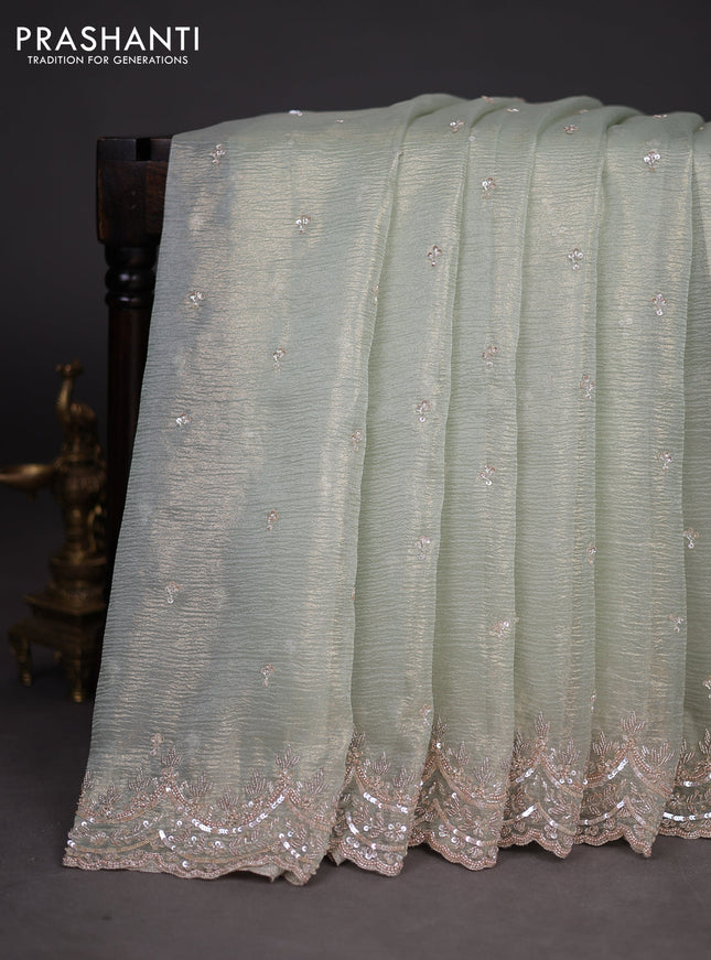 Crush tissue saree pastel green with sequin & cut beaded work