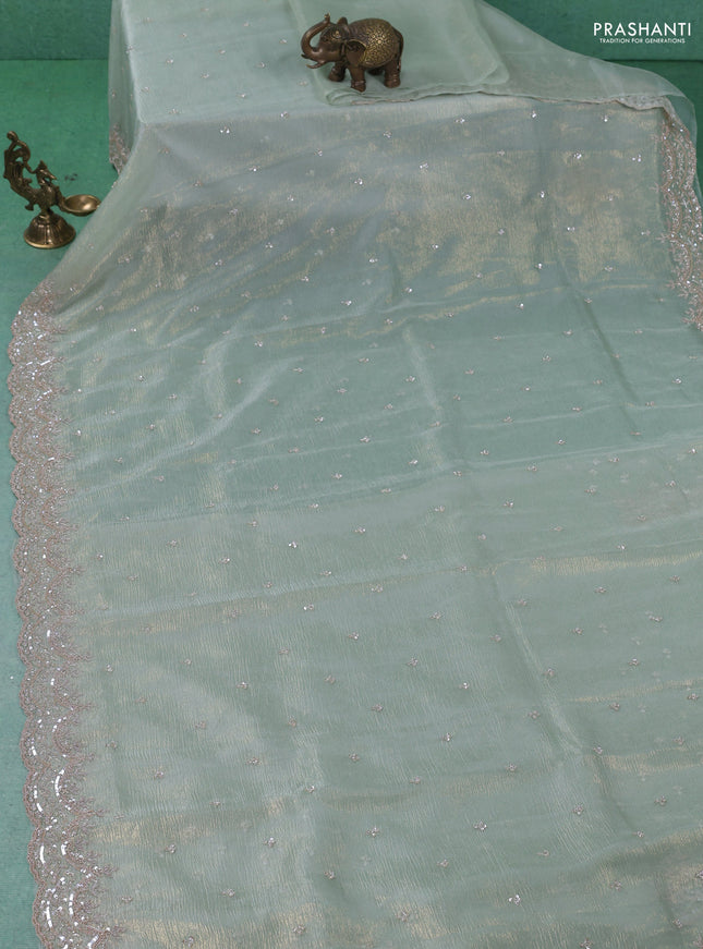 Crush tissue saree pastel green with sequin & cut beaded work