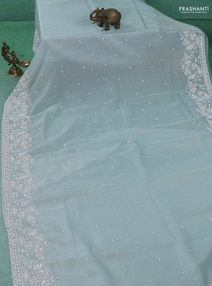 Crush tissue saree pastel green shade with sequin & cut beaded work