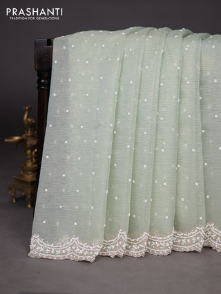 Crush tissue saree pastel green with sequin & cut beaded work
